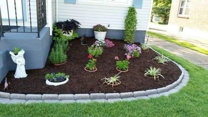 picture of a beautiful garden with plants and fresh soil installed by Santana Landscaping in Seattle Washington