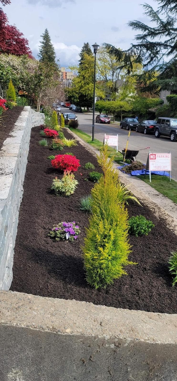 picture of a beautifully designed garden with pavers and retaining walls in a seattle washington home